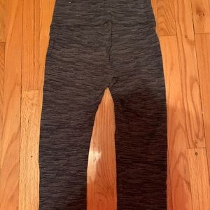 grey capris with small detail cut at bottom